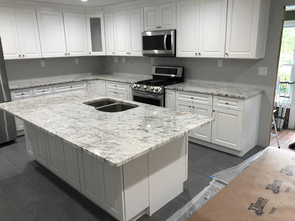 Natural stone kitchen island for a South Florida home by Absolute Marble and Granite